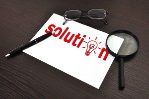 workplace with solution symbol on paper
